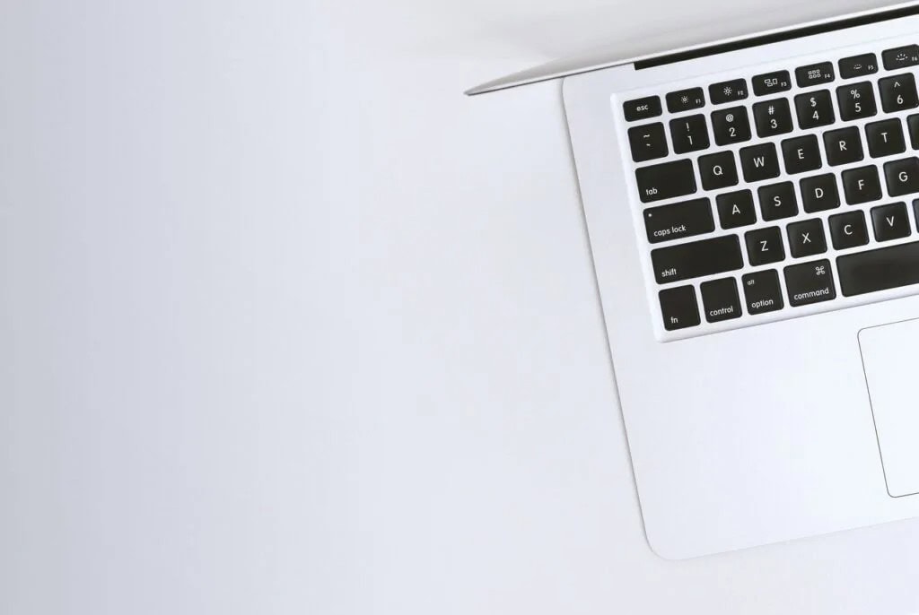 Macbook on a white desk