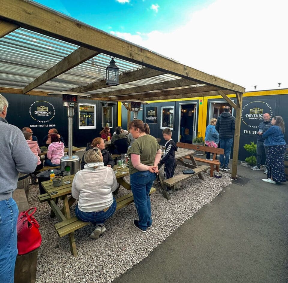 Exterior photo of the Gatehouse Taproom at Devenick Drinks Co. on a summer's day